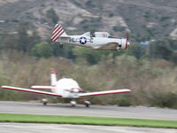 Santa Paula Airport (SZP) - Condor Squadron making another high speed flour bomb pass at riverbed target, Commemorating 7 Dec. 1941 attack on Pearl Harbor. Official scorers were near Rwy 04 windsock cordoned off area. - by Doug Robertson