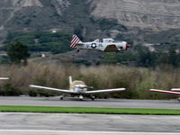 Santa Paula Airport (SZP) - Condor Squadron making another high speed flour bombing pass at the Santa Clara River-bed target Commemorating the 7 Dec. 1941 attack on Pearl Harbor - by Doug Robertson