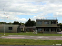 EGYK Airport - A view of the watchtower and nissen hut buildings at the Yorkshire Aviation Museum, Elvington. The Tricolor flies at the mast head as a memorial to the members of the French Sqns based at the airfield in WWII - by Clive Pattle