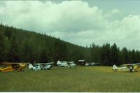 Spotted Bear /usfs/ Airport (8U4) - Spotted Bear with view to the NW. This is the main camping and tiedown area.The truck seen behind my Piper Colt, was for transportation to the near by lodge.Yes indeed, it was nice for these taildragger pilots to let me fly along. - by S B J