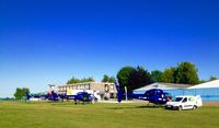 Suarlee Airport - Plenty of helicopters parking spots. In the background, the hotel-restaurant le d'Hélice opened 24h/7D. Next to it, the Café-Brasserie l'Envol offering drinks & during lunchtime also meals, both having  outside terraces with a direct view on traffic. - by DOM:-) 