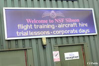 Peterborough/Sibson Airport - Some hangar signage at Sibson EGSP - by Clive Pattle