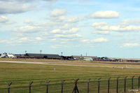 RAF Coningsby Airport, Coningsby, England United Kingdom (EGXC) - Airfield view RAF Coningsby EGXC - viewed from the south side, the 29 (R) Sqn hangar and buildings. The 'Gate Guard' English Electric Lightning can be seen mid image.  - by Clive Pattle