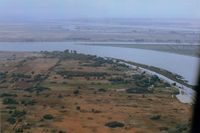 NONE Airport - Bob Ried  strip (private) near Rio Vista,Ca. It is seen in the middle of pic in 1973.It is where I learned that a 65 Tcraft does not get off like a 150 Cub due to short strip and high grass.Very near a NTSB statistic that day!! View is west. - by S B J