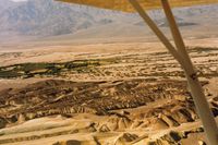 Furnace Creek Airport (L06) - Furnace Creek looking to the SW. Airport is seen at the top of the wing strut. - by S B J