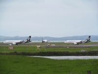 Auckland International Airport, Auckland New Zealand (NZAA) - ZK-OXJ and OXF queuing to leave with OXI just landing in between. View from public lay-by off Puhinui Road. - by magnaman