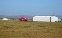 Pembrey Airport - Fire and Rescue Tender No 2 and hangars. - by Roger Winser
