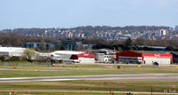Aberdeen Airport, Aberdeen, Scotland United Kingdom (EGPD) - Bond Helicopters hangars at Aberdeen EGPD - with GA park on left of apron. - by Clive Pattle