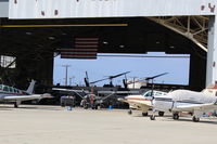 Camarillo Airport (CMA) - Camarillo Aircraft hangar, both ends open. Ventura County Sheriff's Helicopter unit is in western half, some helicopters shown. Usual takeoffs/landings from adjacent ramp. Now in 2019 Sheriff/Ventura County Fire  has total hangar. - by Doug Robertson