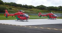 NONE Airport - The two Wales Air Ambulance helicopters (G-HEMN and G-WASN) at their new base at Dafen, Llanelli, Wales UK. - by Roger Winser