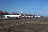 Ngurah Rai Airport (Bali International Airport) - Denpasar has become quite a busy airport: After holding for 30 minutes we finally landed, just to sit on the tarmac for another 30 minutes waiting for a gate to be available. My colleague experienced the same next day... - by Micha Lueck