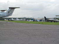Fairoaks Airport - grass parking at fairoaks - by magnaman