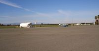 Willows-glenn County Airport (WLW) - Mooney 1DD seen as it taxied from the fuel island. View is to the NW. - by S B J