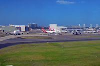 Sydney Airport - QF maintenance base on the left, and QF domestic terminal on the right - by Micha Lueck