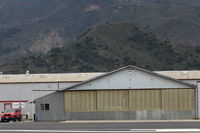 Santa Paula Airport (SZP) - 33 CESSNA TAXI. Another view of Joe Krybus Aviation BUCKER Build Hangar this time also showing his office and entry on left side of Hangar, BU-131 Jungmanns & BU-133 Jungmeisters built/maintained/repaired here. - by Doug Robertson