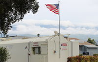 Santa Paula Airport (SZP) - Shifting winds today-Santana building strength forces active runway change to Rwy 04. Note flag at Fuel Dock. - by Doug Robertson