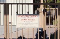 Santa Paula Airport (SZP) - Aviation Museum of Santa Paula-Days, Hours of Open House most First Sundays. This gate at airport entry parking lot otherwise locked. - by Doug Robertson