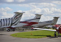 Fairoaks Airport, Chobham, England United Kingdom (EGTF) - A trio of Pilatus PC12s at Fairoaks. - by moxy