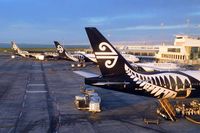 Auckland International Airport, Auckland New Zealand (NZAA) - Air New Zealand's black and white birds basking in the morning sun, while getting ready for the first flights of the day - by Micha Lueck