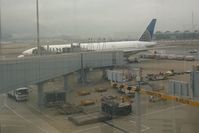 Hong Kong International Airport - UA896 preparing for the long flight from Hong Kong to Chicago O'Hare. - by Bob Simmermon