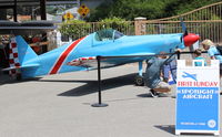 Santa Paula Airport (SZP) - Aviation Museum of SZP 1100 hours Featured Aircraft Presentation-by Grandson pilot (crouching) of the builder of DeweyBird (highly modified Super Cosmic Wind Racer) purchased back from Arizona  - by Doug Robertson