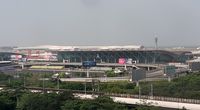 Shenzhen Bao'an International Airport - Shenzhen Airport view from hotel over the 'old' terminal. - by FerryPNL