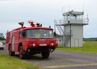 Pembrey Airport, Pembrey, Wales United Kingdom (EGFP) - Former Royal Navy fire and rescue tender 'Fire 2' by the airport's control tower  - by Roger Winser