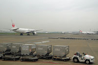 Tokyo International Airport (Haneda), Ota, Tokyo Japan (RJTT) - A grey morning, but Haneda is busy as ever... - by Micha Lueck