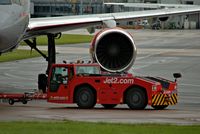 Manchester Airport, Manchester, England United Kingdom (EGCC) - JET2[EXS] aircraft tug pushing G-LSAB B757 JET2  - by andysantini