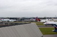 London Heathrow Airport, London, England United Kingdom (EGLL) - Heathrow Terminal 2 seen from T4 - by FerryPNL