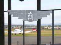 Archerfield Airport - DCA (Department of Civil Aviation) etched on the window of the waiting lounge - Archerfield Qld - by Arthur Scarf