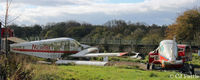 Dunkeswell Aerodrome - Scrapyard area at Dunkeswell, includes L-R N23181, TC-NLB and G-BPRV. - by Clive Pattle