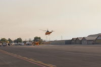 Santa Paula Airport (SZP) - Takeoff hover of a Thomas Fire FireBomber into a smoky sky. - by Doug Robertson