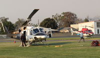 Santa Paula Airport (SZP) - Two firebombers at SZP between sorties at the Thomas Fire - by Doug Robertson