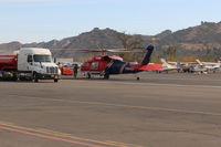 Santa Paula Airport (SZP) - N135BH 1987 Sikorsky FIREHAWK S-70A-27 GE T700 Series, Restricted class, readying for firebomb action, at SZP  Thomas fire FireBase. - by Doug Robertson