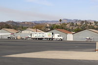 Santa Paula Airport (SZP) - SZP Thomas FireBase Firefighter's Food Support Truck-last vestige of FireBase Support moving to depart SZP. Note smoky skies from the fire still spreading. - by Doug Robertson