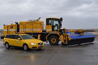 Boise Air Terminal/gowen Fld Airport (BOI) - The Volvo friction tester beside a new sweeper/blower combo in one truck. - by Gerald Howard