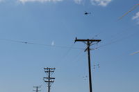 Camarillo Airport (CMA) - A Ventura County Sheriff Helicopter maneuvering over and near CMA-Airport on test exercises today. Their Shooting Practice Range is just west of CMA airport western boundary. - by Doug Robertson