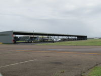 Archerfield Airport - private open hangars - by magnaman