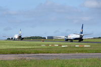 Norwich International Airport - YL-LCO and G-JMCS both on taxiway Charlie. - by Graham Reeve