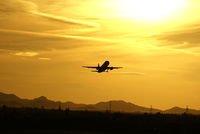 Phoenix Sky Harbor International Airport (PHX) - A takeoff into an amazing Arizona sunset.  This picture is not adjusted; this is the way the sky really looked. - by Dave Turpie