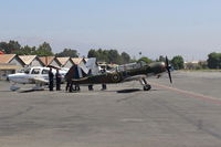 Santa Paula Airport (SZP) - Santa Paula Fire Department Firemen undergoing in-service training at the SZP Transient Ramp next to the Yak 52. - by Doug Robertson