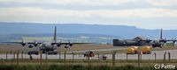 RAF Lossiemouth - Two RAF Hercules taxy on the airfield - by Clive Pattle