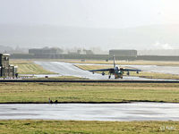 RAF Lossiemouth Airport, Lossiemouth, Scotland United Kingdom (EGQS) - The sunshine after the rain - A Tornado GR4 is towed across the airfield - by Clive Pattle