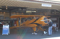 Santa Paula Airport (SZP) - First Sunday Aviation Museum of Santa Paula Featured Aircraft 1939 N100BU Bucker Jungmeister Angel with owner seated-right.  - by Doug Robertson