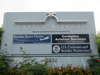 John H Batten Airport (RAC) - sign at entry to car aprk - by magnaman