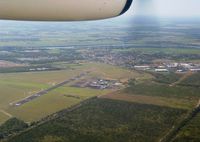 Bundaberg Airport, Bundaberg, Queensland Australia (YBUD) - Bundaberg Airport YBUD ‘Airport Overview’ as seen from Qantaslink DHC-8-102 Dash8 VH-TNW arriving from Brisbane YBBN on 31Dec2002. (‘Sugarland’ visible at right). - by Walnaus47