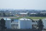 Paris Orly Airport, Orly (near Paris) France (LFPO) - storage tanks at Paris-Orly airport, in the background the aircraft of Athis-Mons aviation museum (Concorde, Mercure and Caravelle) - by Ingo Warnecke