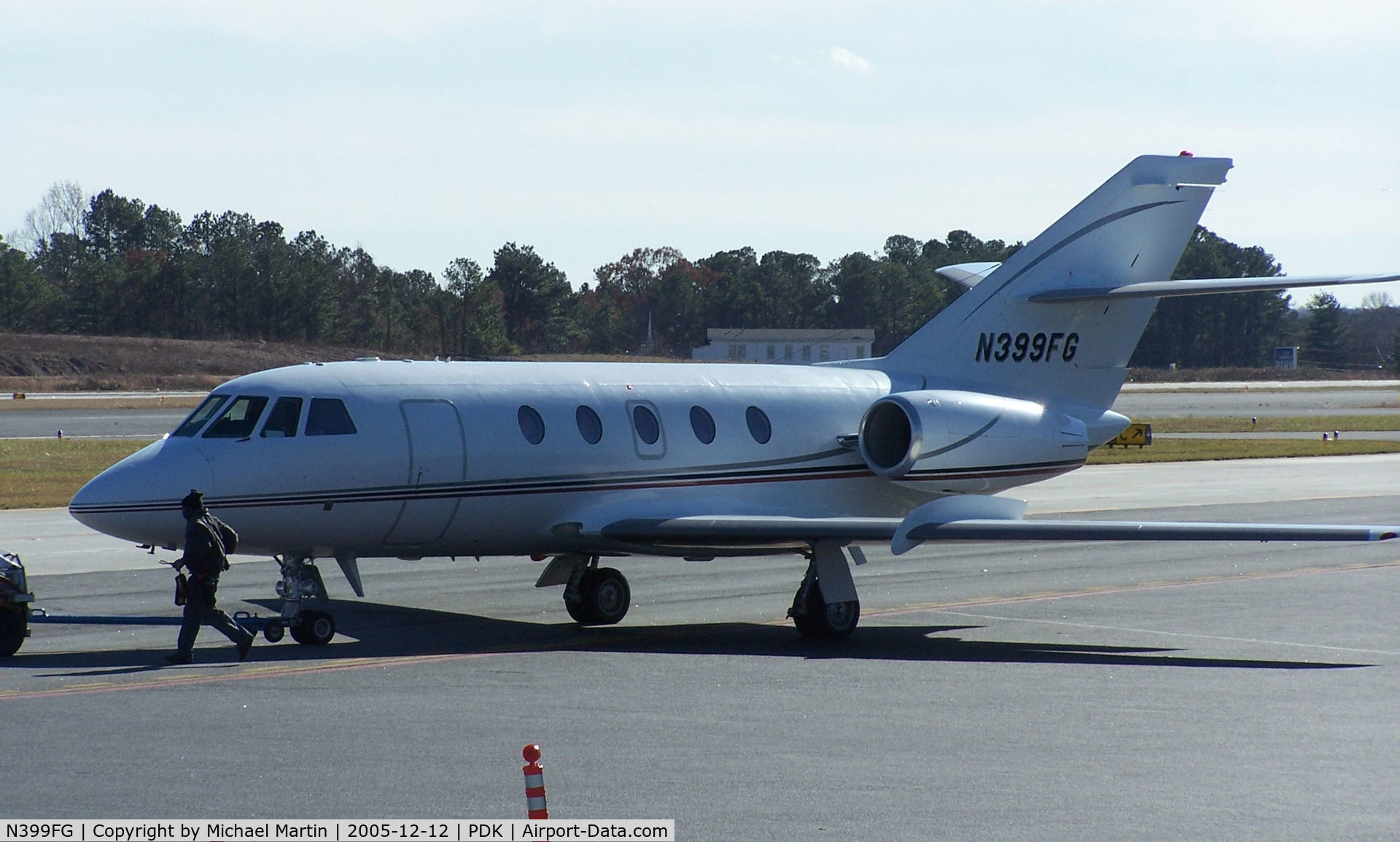 N399FG, 1977 Dassault Falcon (Mystere) 20F-5 C/N 373, Being towed to parking at Mercury Air Center