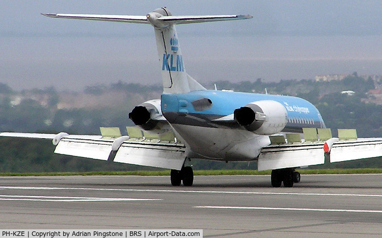 PH-KZE, 1996 Fokker 70 (F-28-0070) C/N 11576, KLM Fokker 70 (PH-KZE) landing at Bristol Airport, Bristol, England in August 2004. The airbrake flight controls are the raised cream-coloured panels on the wing upper surface.